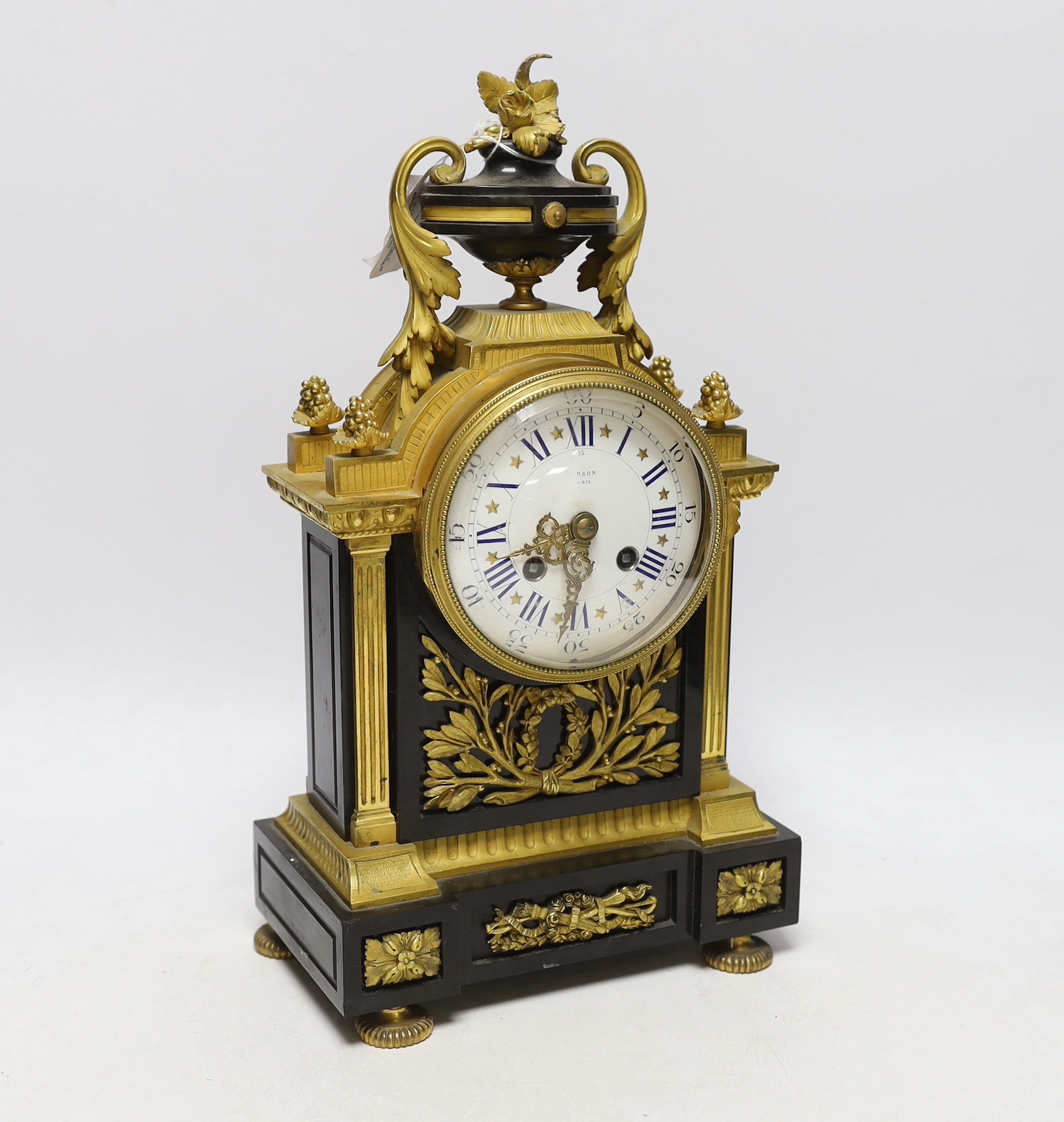 A Louis XVI style bronze and ormolu mantel clock, the enamel dial inscribed Gibson, Paris, 37cm high
